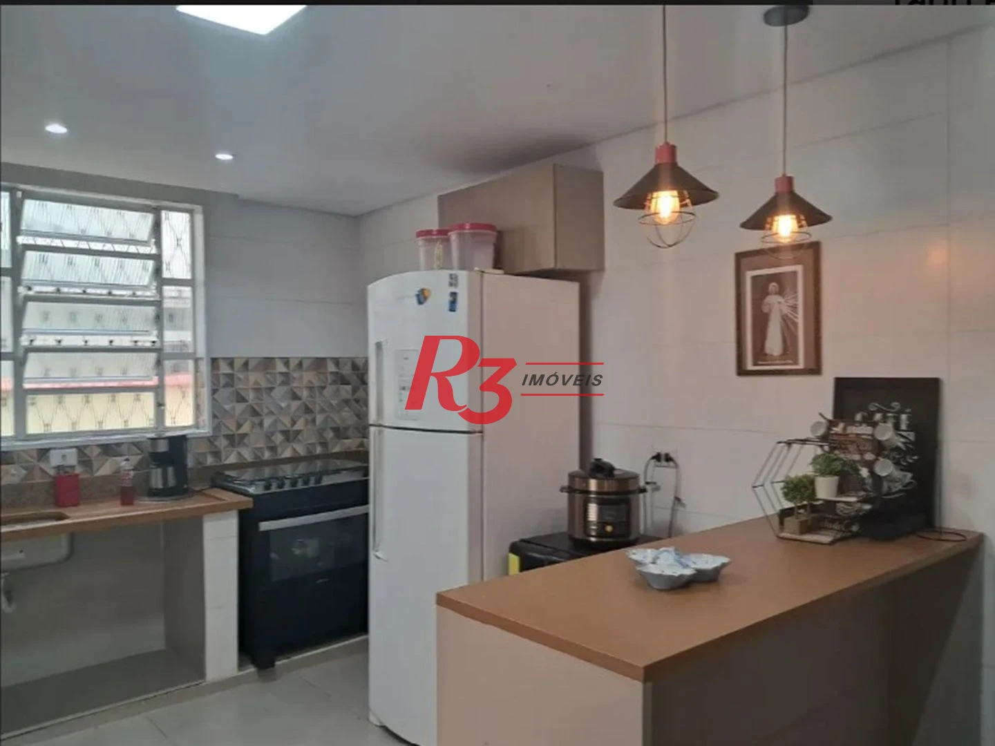 Sobrado com 3 dormitórios à venda, 134 m² por R$ 970.000,00 - Embaré - Santos/SP