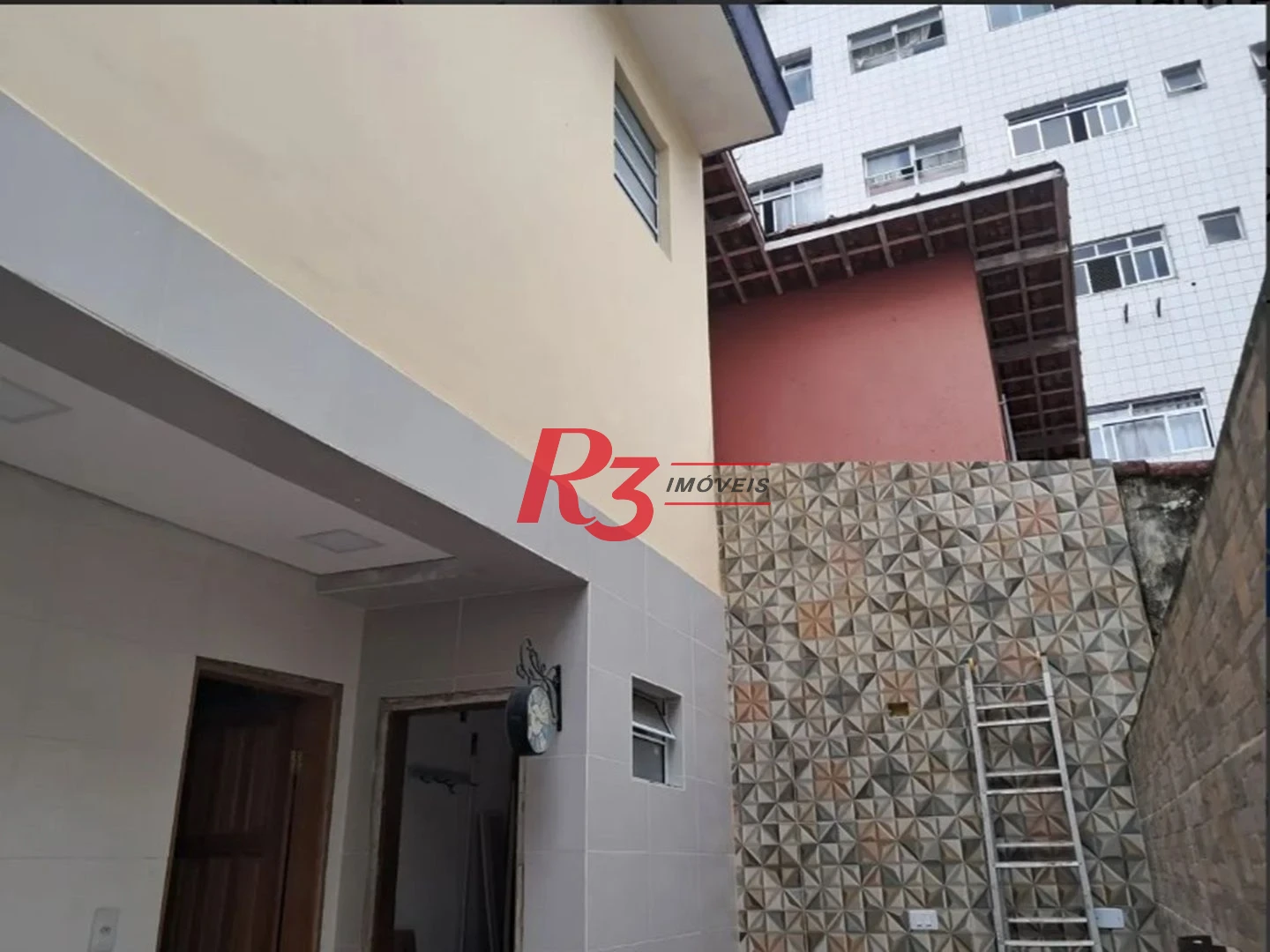 Sobrado com 3 dormitórios à venda, 134 m² por R$ 970.000,00 - Embaré - Santos/SP