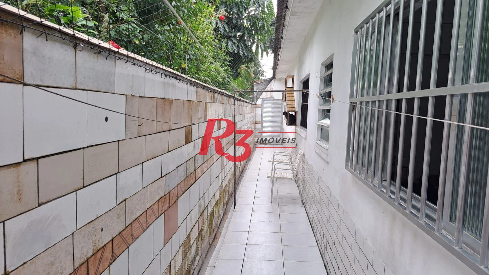 Casa com 3 dormitórios à venda, 155 m² por R$ 950.000,00 - Estuário - Santos/SP