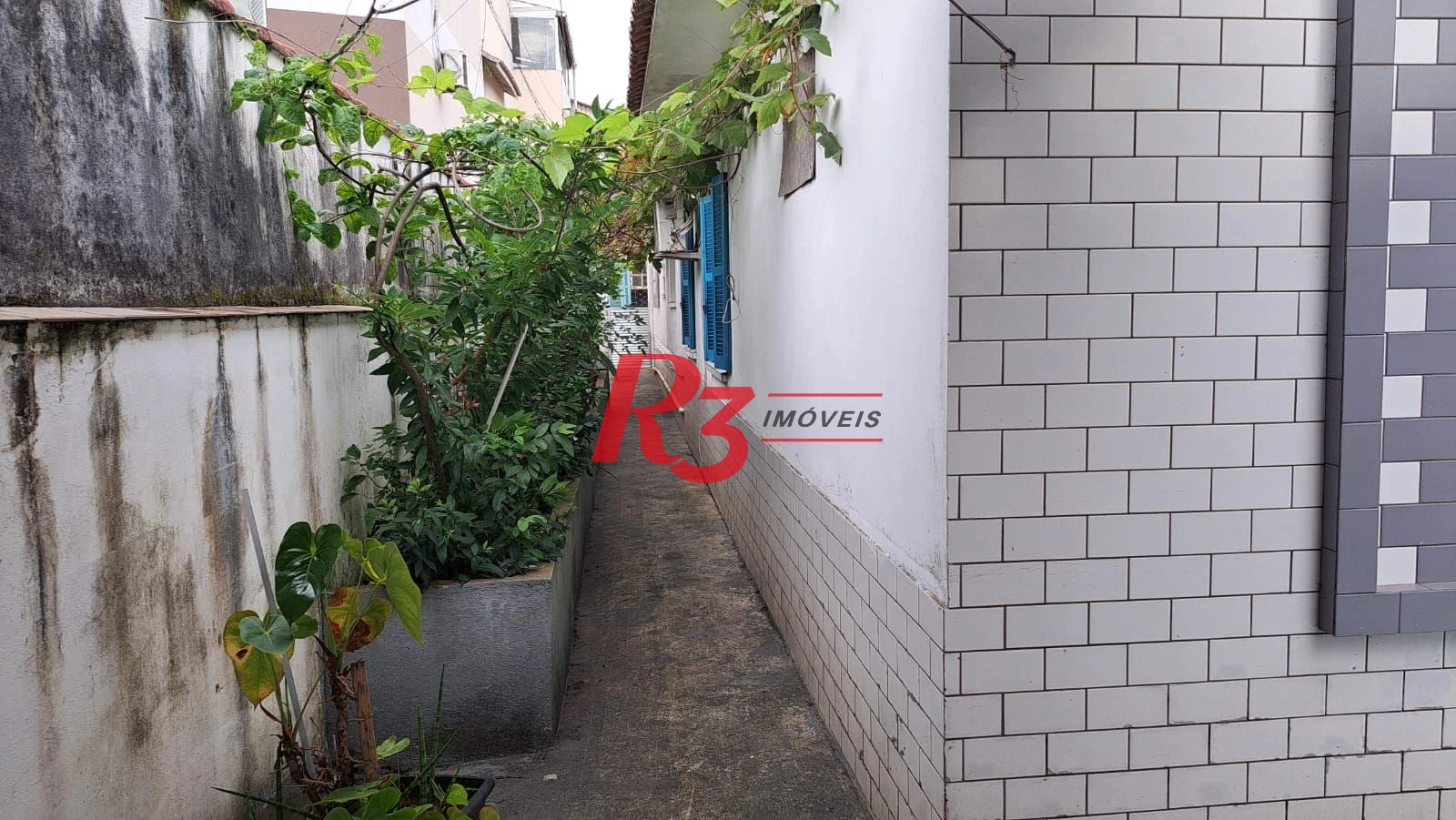 Casa com 3 dormitórios à venda, 155 m² por R$ 950.000,00 - Estuário - Santos/SP