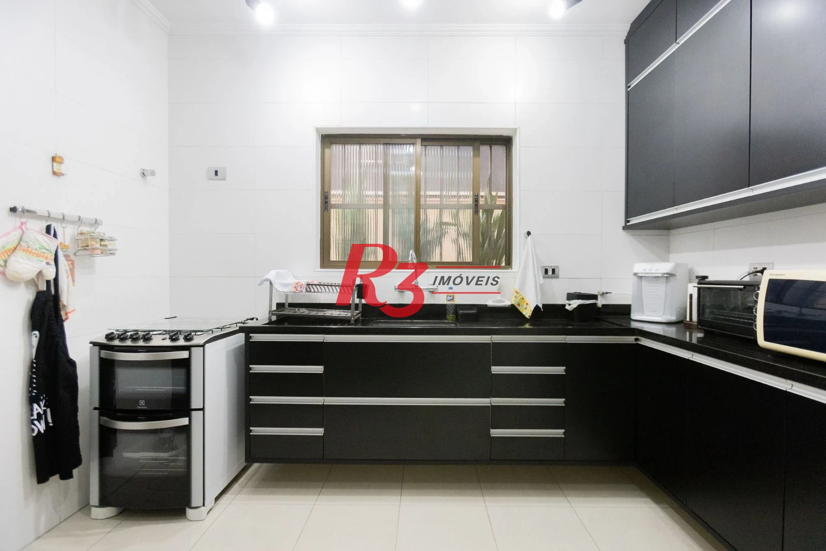 Casa com 3 dormitórios à venda, 159 m² por R$ 1.700.000,00 - Aparecida - Santos/SP