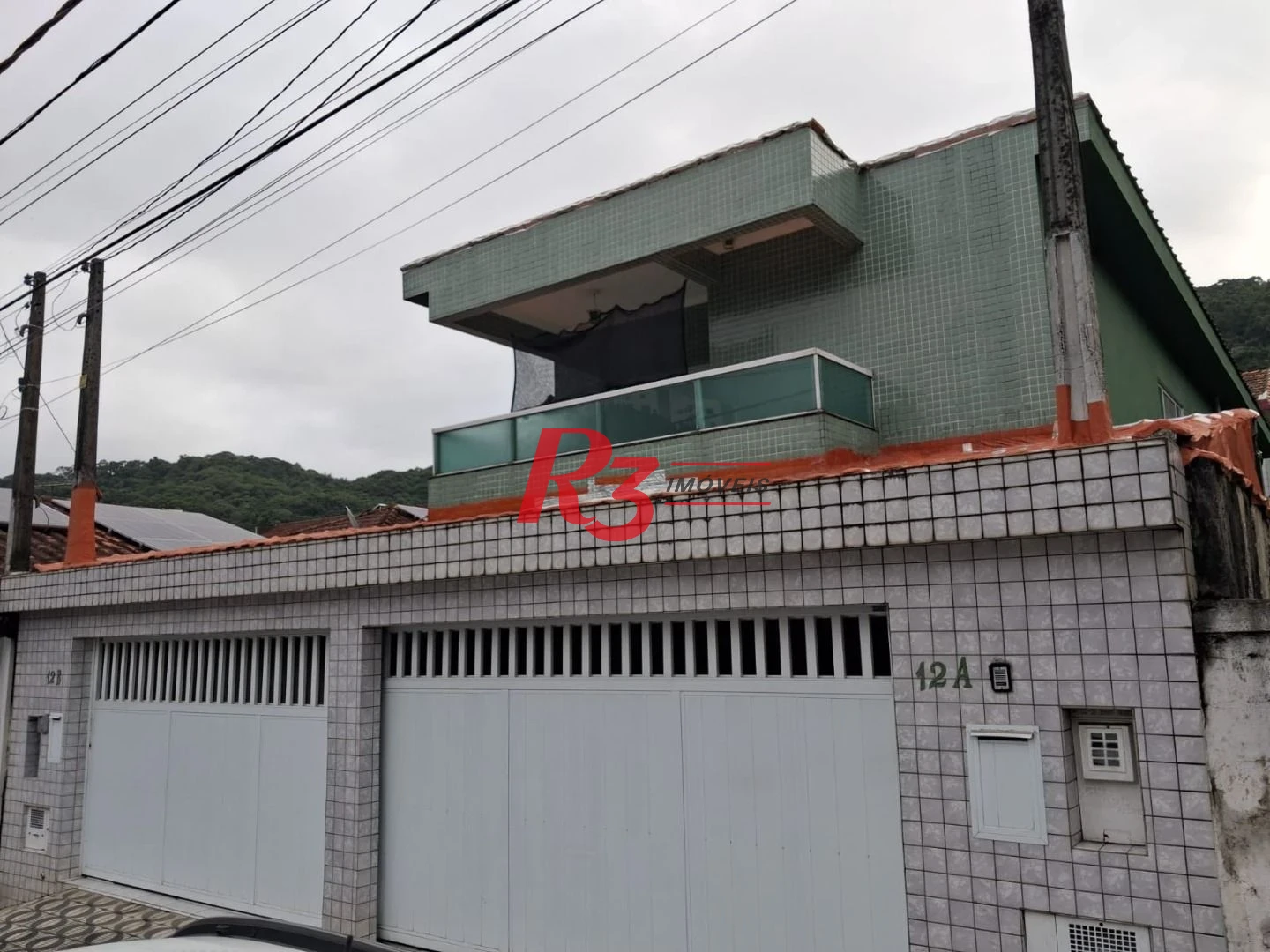 Sobrado com 3 dormitórios à venda, 170 m² por R$ 745.000,00 - Jabaquara - Santos/SP