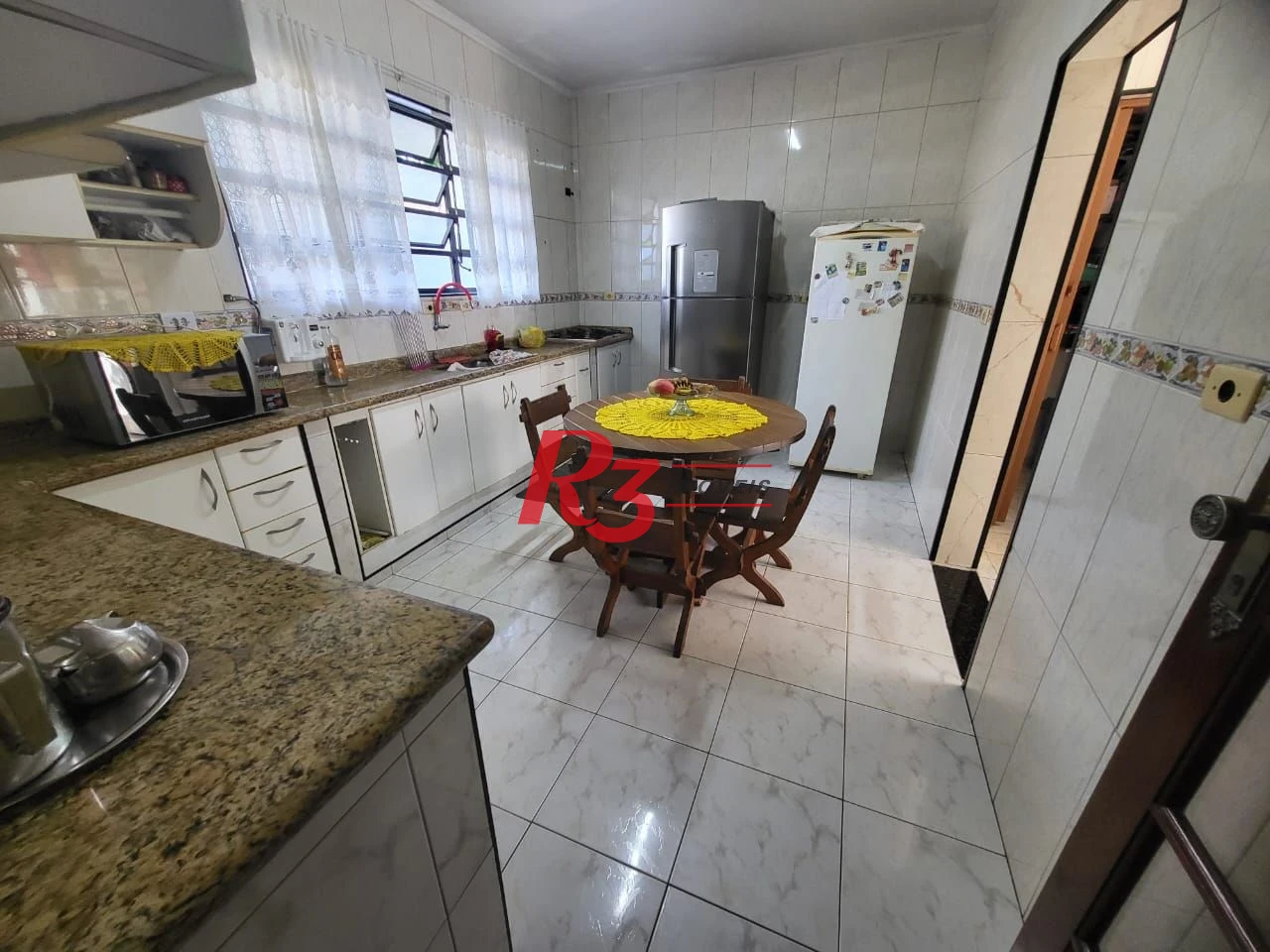 Sobrado com 4 dormitórios à venda, 166 m² por R$ 1.490.000,00 - Embaré - Santos/SP