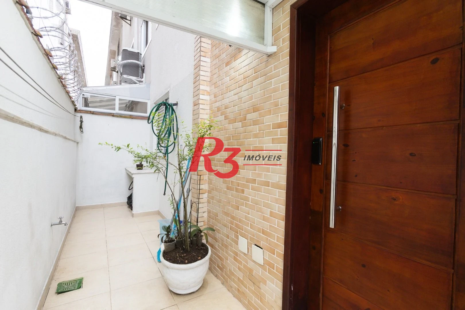 Casa com 3 dormitórios à venda, 123 m² por R$ 720.000,00 - Macuco - Santos/SP