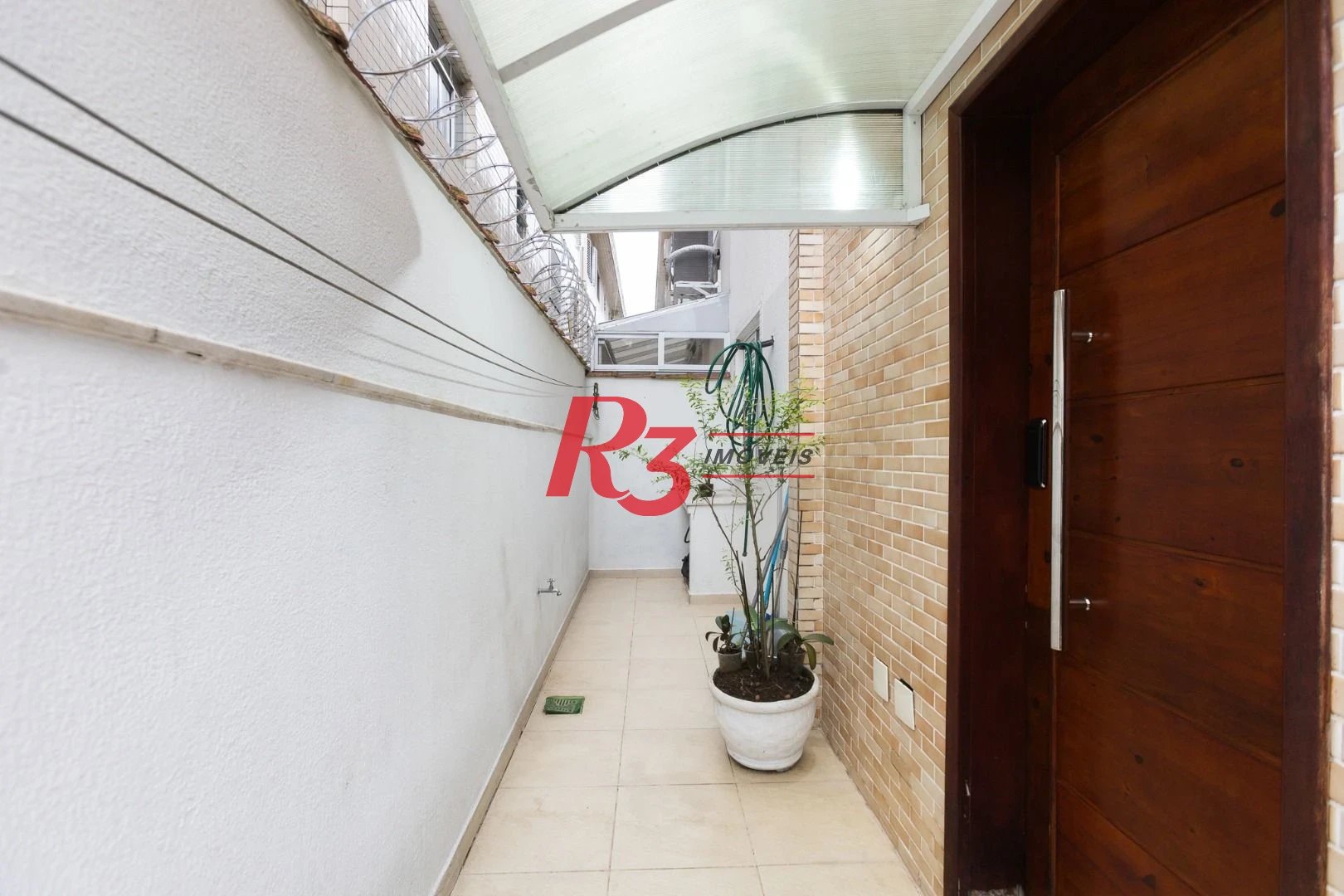 Casa com 3 dormitórios à venda, 123 m² por R$ 720.000,00 - Macuco - Santos/SP