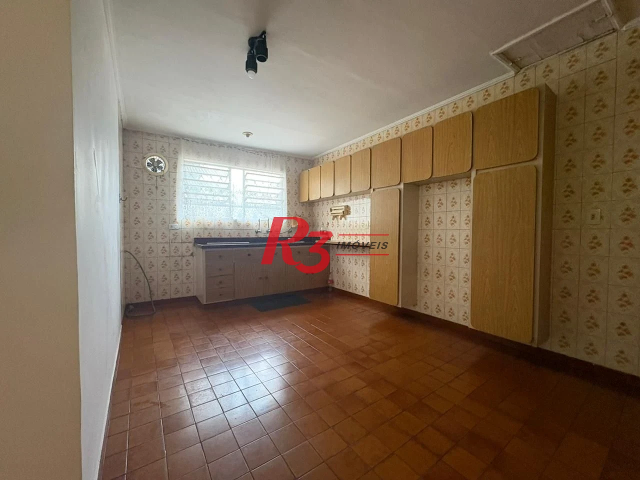 Casa com 3 dormitórios para alugar, 150 m² por R$ 3.000,00/mês - Macuco - Santos/SP