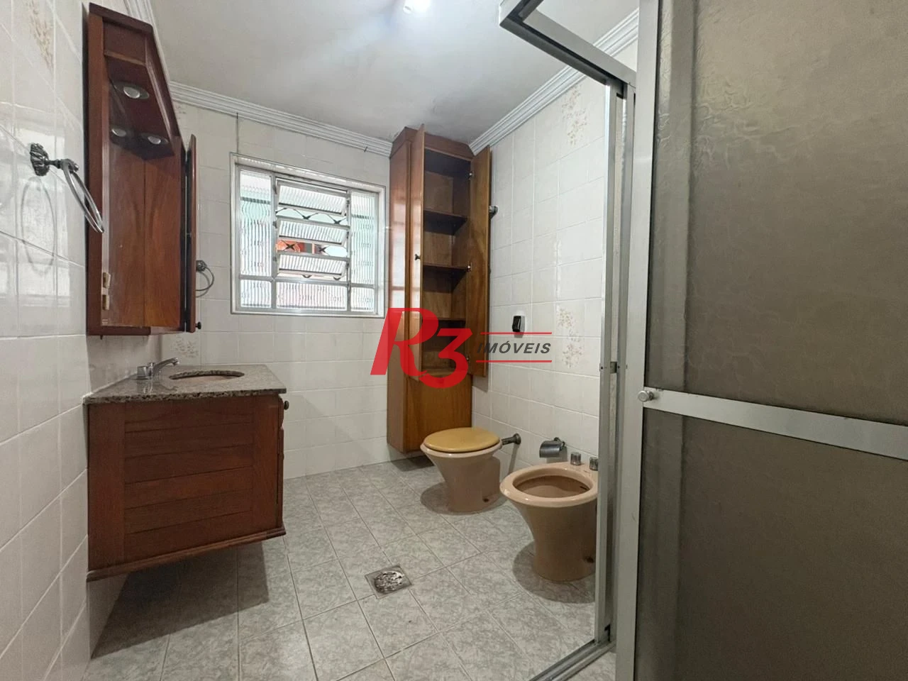 Casa com 3 dormitórios para alugar, 150 m² por R$ 3.000,00/mês - Macuco - Santos/SP