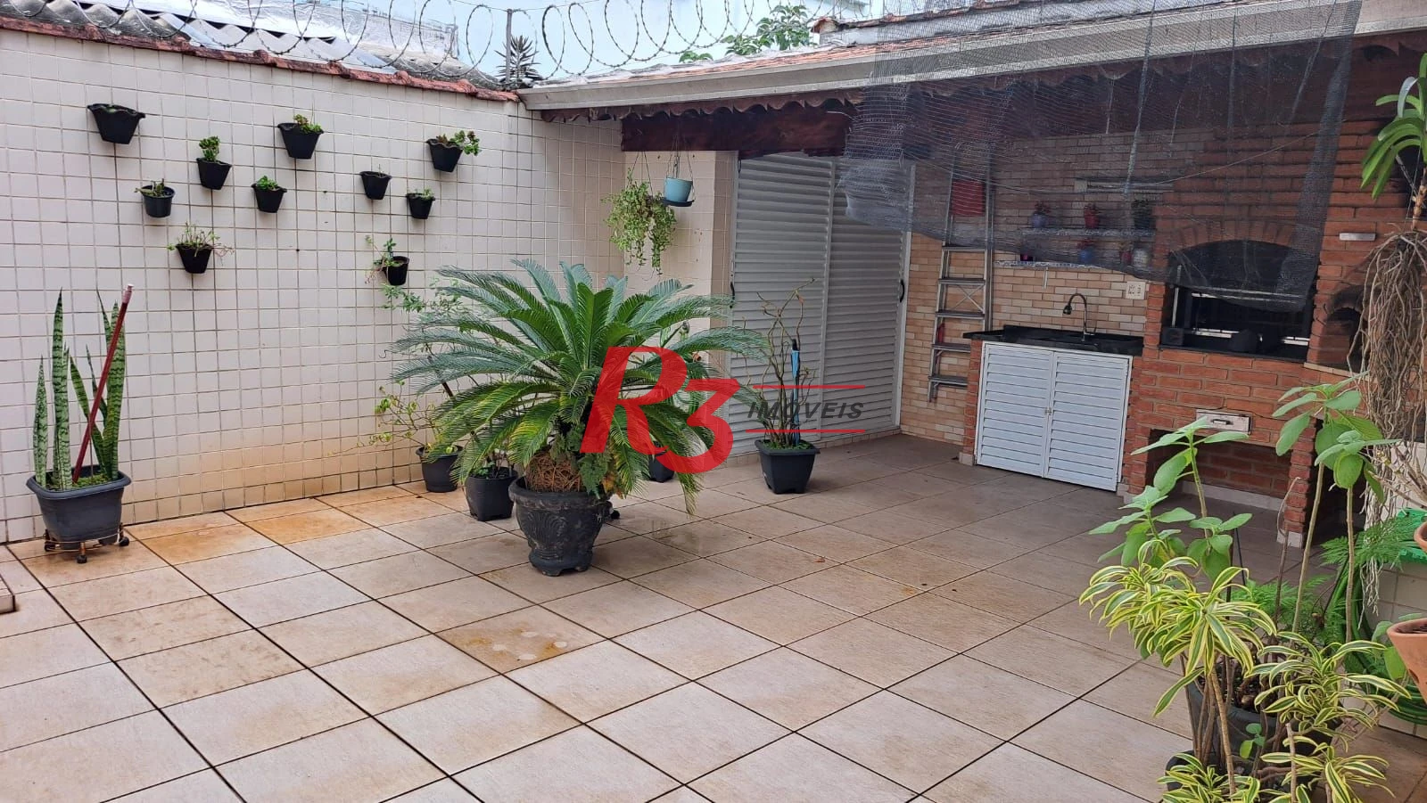 Casa com 3 dormitórios à venda, 161 m² por R$ 1.420.000,00 - Embaré - Santos/SP