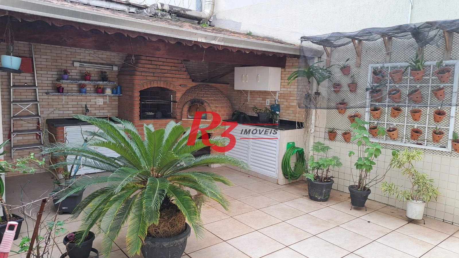 Casa com 3 dormitórios à venda, 161 m² por R$ 1.420.000,00 - Embaré - Santos/SP