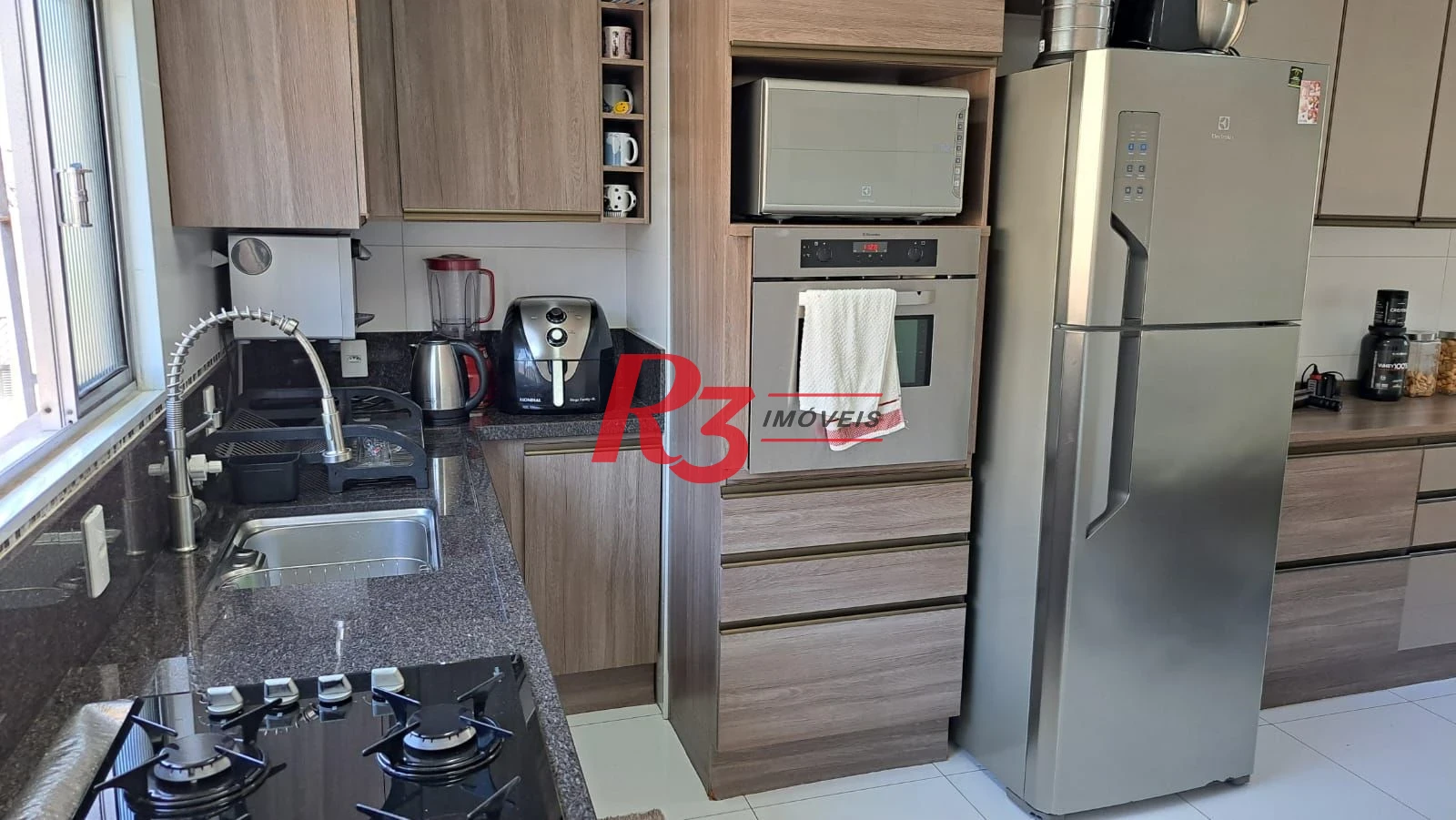 Casa com 3 dormitórios à venda, 147 m² por R$ 1.085.000,00 - Estuário - Santos/SP