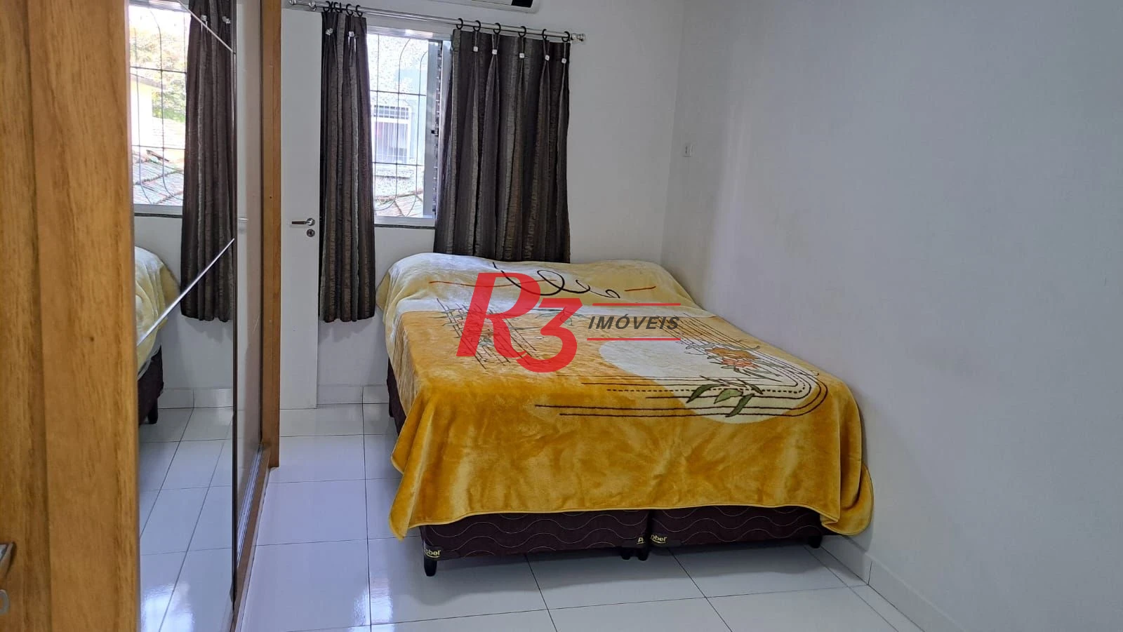 Casa com 3 dormitórios à venda, 147 m² por R$ 1.085.000,00 - Estuário - Santos/SP