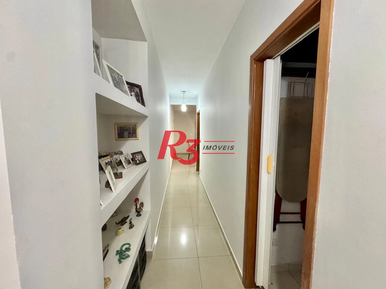 Sobrado com 4 dormitórios à venda, 203 m² por R$ 1.500.000,00 - Estuário - Santos/SP