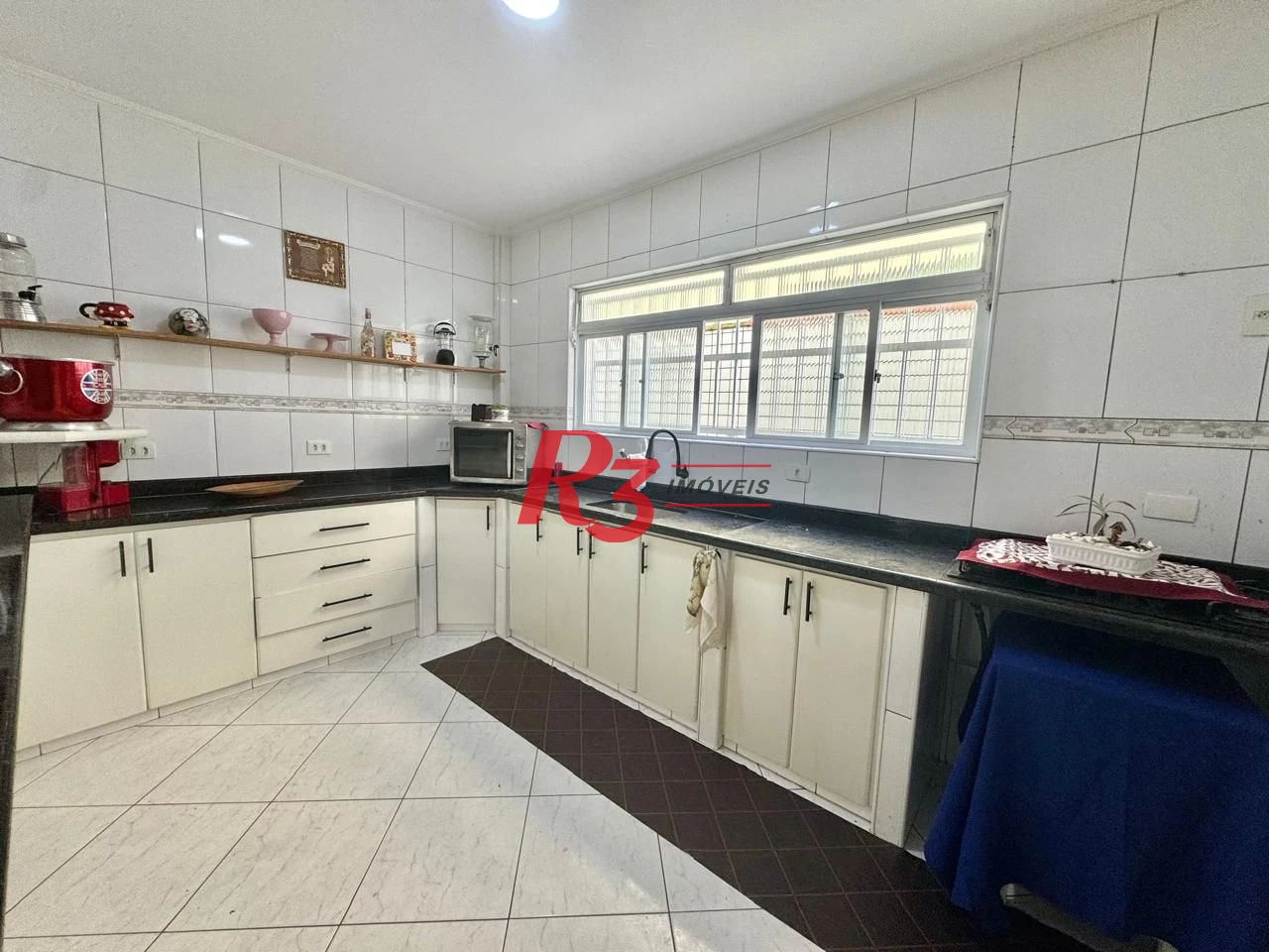 Sobrado com 4 dormitórios à venda, 203 m² por R$ 1.500.000,00 - Estuário - Santos/SP