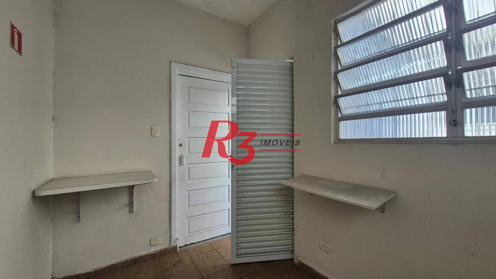 Sobrado com 3 dormitórios à venda, 195 m² por R$ 1.300.000,00 - Gonzaga - Santos/SP