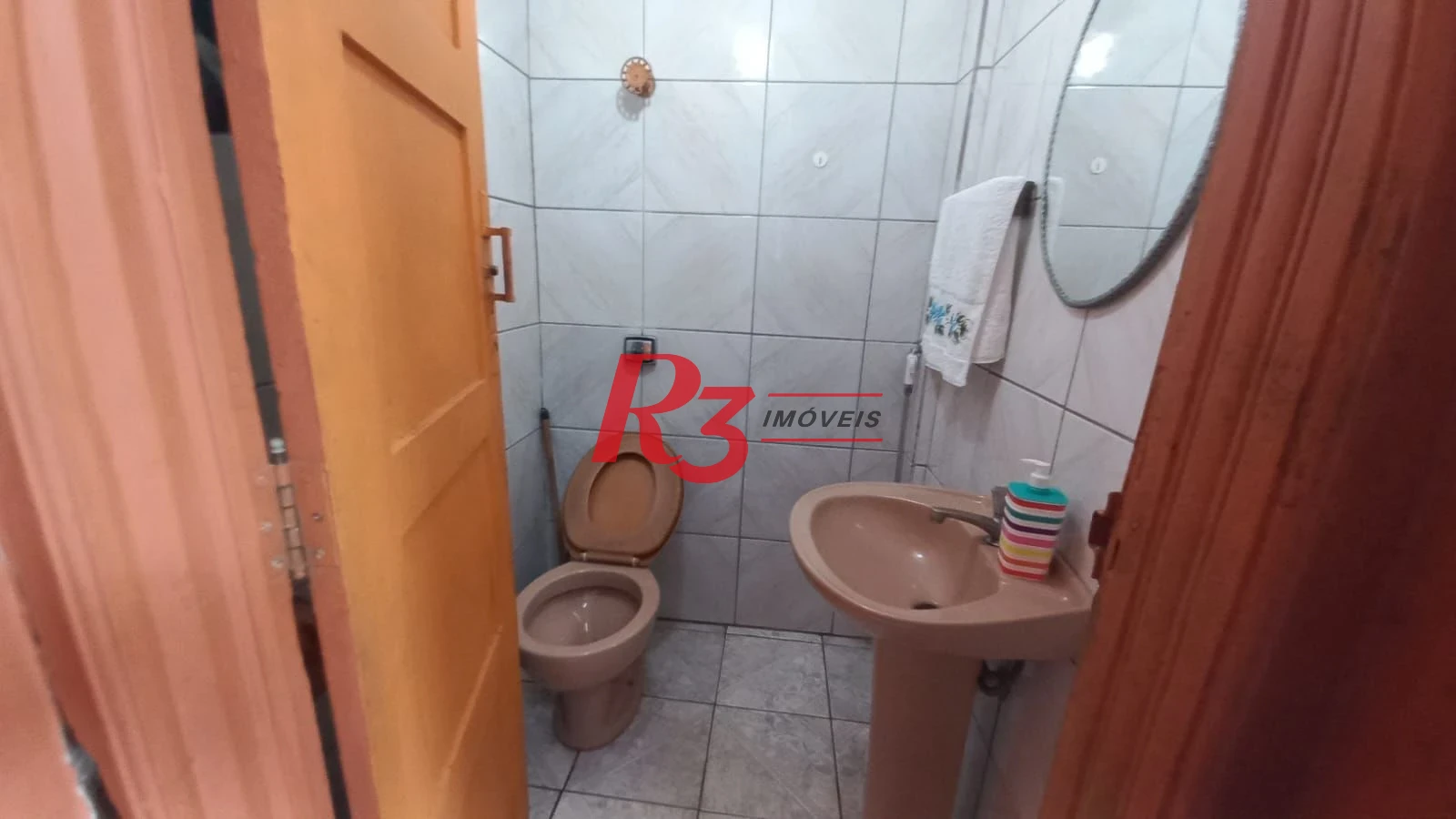 Casa com 3 dormitórios à venda, 142 m² por R$ 680.000,00 - Vila Mathias - Santos/SP