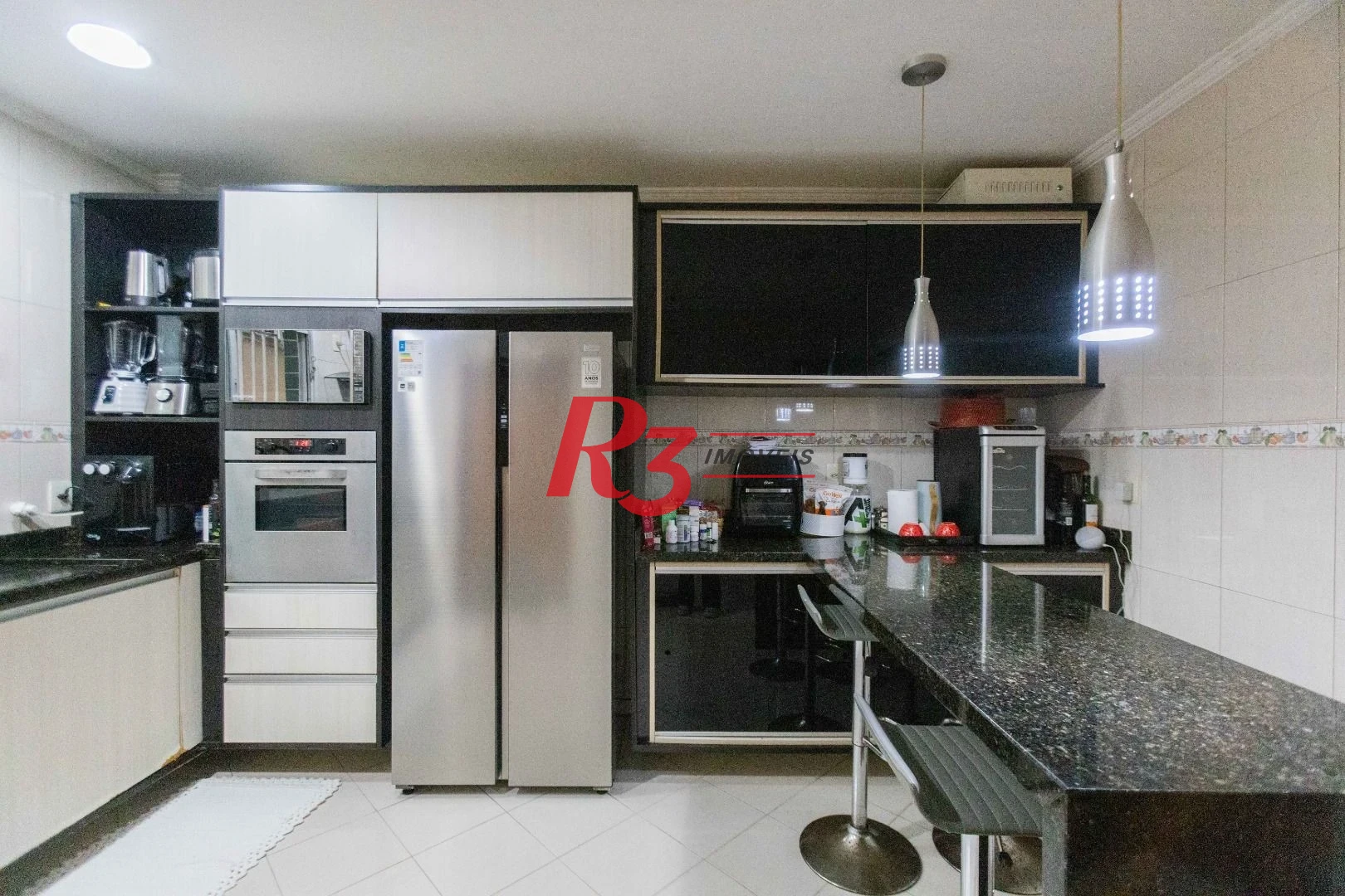 Casa com 3 dormitórios à venda, 275 m² por R$ 1.500.000,00 - Macuco - Santos/SP