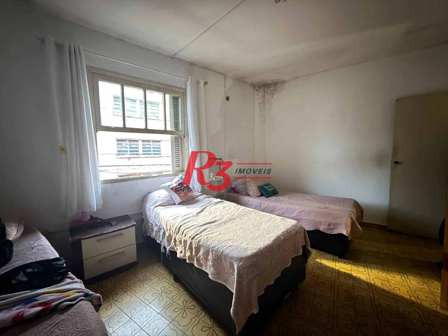 Prédio à venda, 326 m² por R$ 1.300.000,00 - Paquetá - Santos/SP
