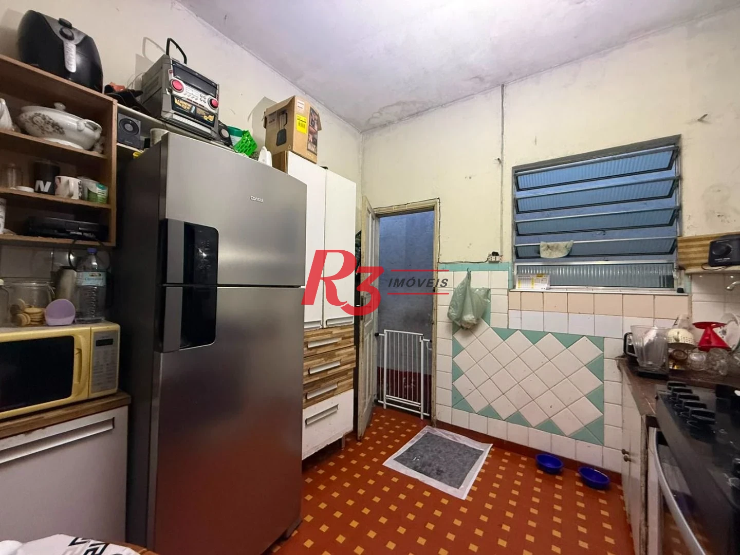 Prédio à venda, 326 m² por R$ 1.300.000,00 - Paquetá - Santos/SP