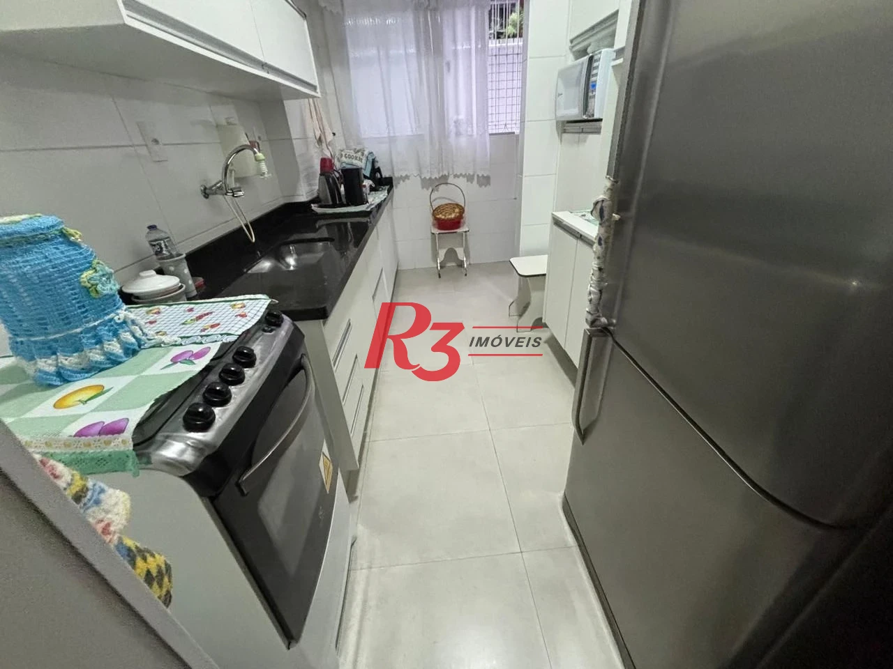 Apartamento com 2 dormitórios à venda, 75 m² por R$ 420.000,00 - Embaré - Santos/SP